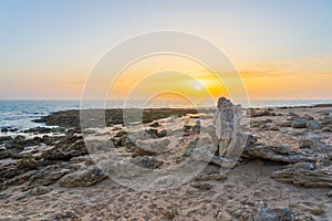 Beautiful shot of a sunrise in the seashore of zahora spain photo