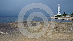 Beautiful shot of the Tarkhankut Lighthouse facing the sea located in Crimea