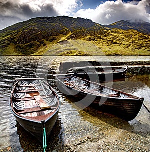 Beautiful shot of three Doo Lough rowing boats with the Irish Sheeffrey Hills in the background