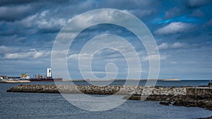 Beautiful shot of the Torre de control Maritimo from the beach of Santa Cristina Galicia in Spain photo