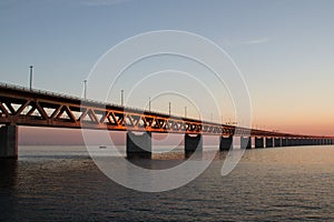 Beautiful shot of the Utsiktspunkt Ã–resundsbron bridge over the water under a blue sky