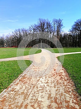 Beautiful shot of the walkway splitting into four ways in the park in Jelenia GÃ³ra, Poland.