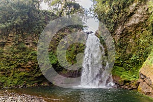 Beautiful shot of a waterfall flowing through a missy rough cliff in Xico, Veracruz, Mexico