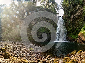 A beautiful shot of a waterfall flowing through a missy rough cliff in Xico, Veracruz, Mexico