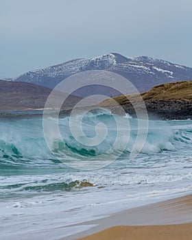 Beautiful shot of waves washing up the shore in Harris, Outer Hebrides