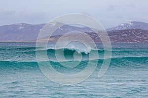 Beautiful shot of waves washing up the shore in Harris, Outer Hebrides