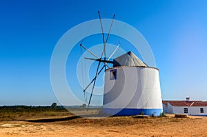 Beautiful shot of a white windmill on a blue sky background