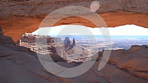 Beautiful shot of wide arch and canyons in the background in moab utah