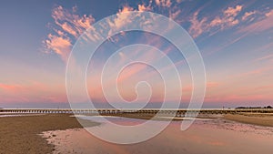 Beautiful shot of wispy clouds adorning the Long Jetty at sunrise, Port Welshpool