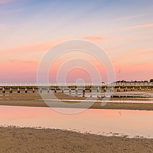 Beautiful shot of wispy clouds adorning the Long Jetty at sunrise, Port Welshpool