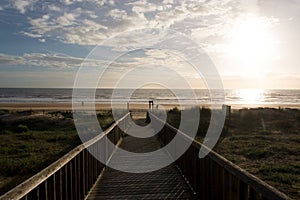 Beautiful shot of the wooden walkway to the beach