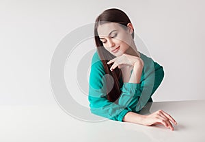 Beautiful shy woman portrait on white background