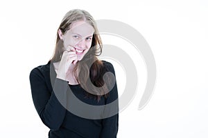 Beautiful shy woman smiling timid hand on chin bites fingers isolated on white background