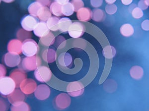 Beautiful side on a dark background. Pink shimmer and circles on a blue and gray background. Festive abstract background