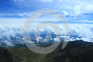 Beautiful sight of quito from the top of Rucu Pinchincha with a stunning cloudscape photo