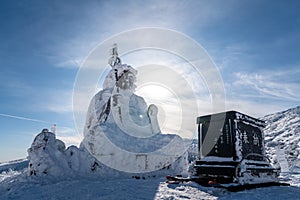 Beautiful silhouette scenic view of Big buddha jizo statue on summit of zao mountain, yamagata, tohoku, japan with snow in winter photo