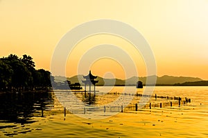 The beautiful of silhouette sunset landscape scenery of Xihu West Lake and pavilion in Hangzhou CHINA