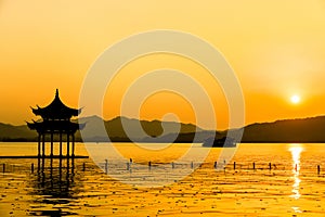 The beautiful of silhouette sunset landscape scenery of Xihu West Lake and pavilion in Hangzhou CHINA