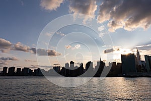 Beautiful Silhouettes of Skyscrapers in the Midtown Manhattan Skyline during a Sunset over the East River in New York City