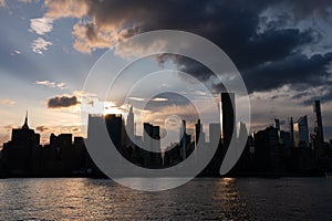 Beautiful Silhouettes of Skyscrapers in the Midtown Manhattan Skyline during a Sunset over the East River in New York City