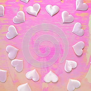 Beautiful silk pink hearts on a pink background. Holiday concept Valentine`s Day. Flat lay.