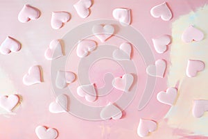 Beautiful silk pink hearts on a pink background. Holiday concept Valentine`s Day. Flat lay.