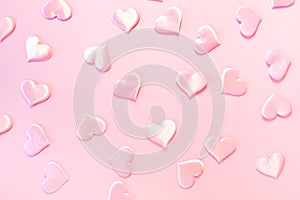 Beautiful silk pink hearts on a pink background. Holiday concept Valentine`s Day. Flat lay.