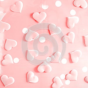 Beautiful silk pink hearts on a pink background. Holiday concept Valentine`s Day. Flat lay.