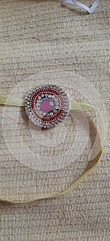 Beautiful silk thread called rakhi tying on Indian festival rakshabandhan