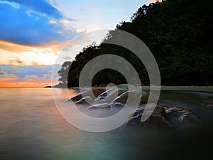 Sunset view with silky smooth water reflection on the sea shore landscape with beautiful sunset view.