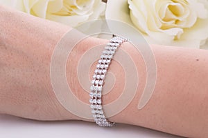 Silver Bracelete with diamonds on white background