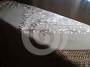 Beautiful shiny and silver fabric with flower decoration