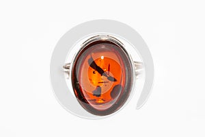 Beautiful silver ring with amber and insect inside isolated on white background