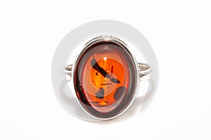 Beautiful silver ring with amber and insect inside isolated on white background