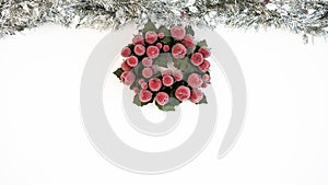 Beautiful silver tinsel christmas with of holly leaf wreath and copy space. Xmas
