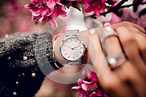 Beautiful silver watch on woman hand