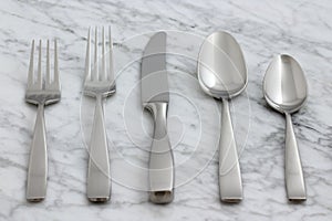 Beautiful silverware on carrara marble