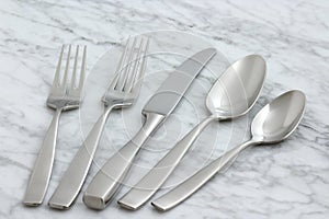 Beautiful silverware on carrara marble