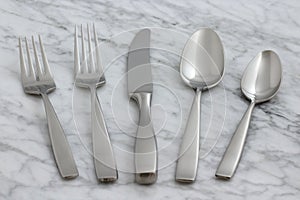 Beautiful silverware on carrara marble