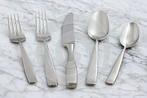 Beautiful silverware on carrara marble