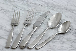 Beautiful silverware on carrara marble