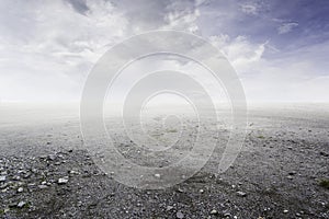 Beautiful simple gravel background with mist and clouds