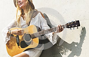 Beautiful singer songwriter with her guitar