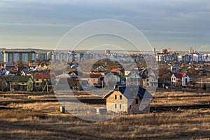 Beautiful single family two story brick house under construction. Typical new home in the suburbs beind built with view of a city