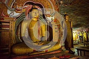 Beautiful sitting Buddha statue inside Dambulla cave temple a sacred pilgrimage site in Sri Lanka.