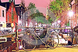 The beautiful sity landscape with bike on the bridge in evening Amsterdam