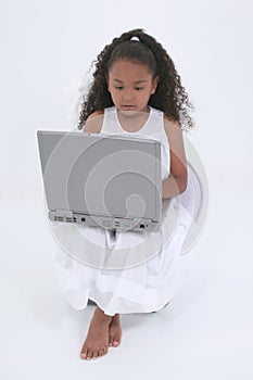 Beautiful Six Year Old Girl With Laptop Over White