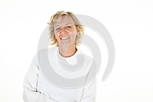 Beautiful sixties senior blonde mature woman on white background