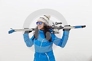 Beautiful Skier woman on top of the mountain. Fog. Winter season