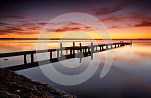 Beautiful skies over Tuggerah Lake with old jetty photo